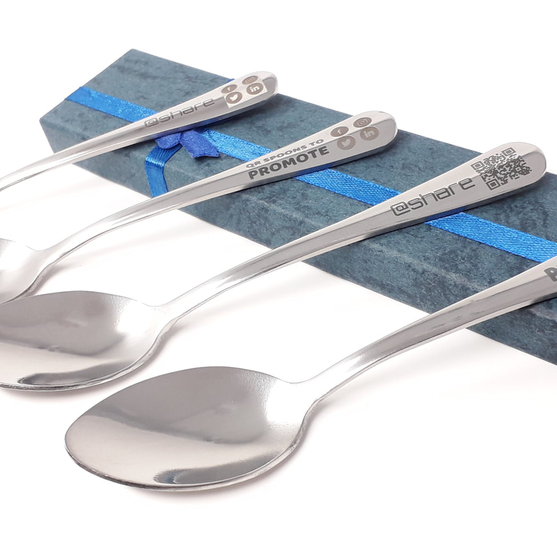 Row of spoons that have been laser marked and engraved with QR codes for social media sharing of the owners business details.